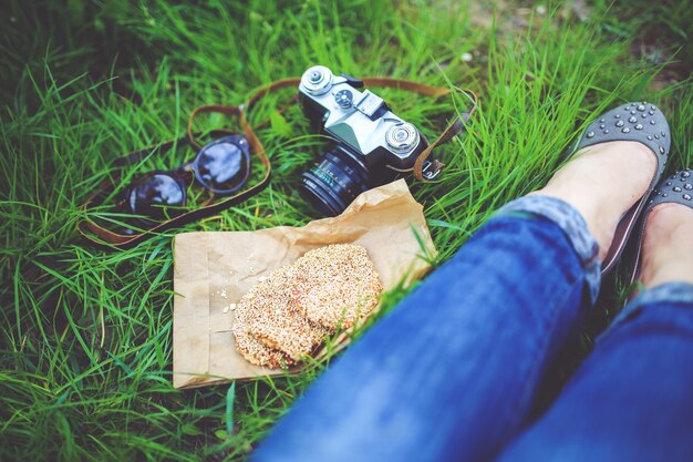 Old camera and female legs