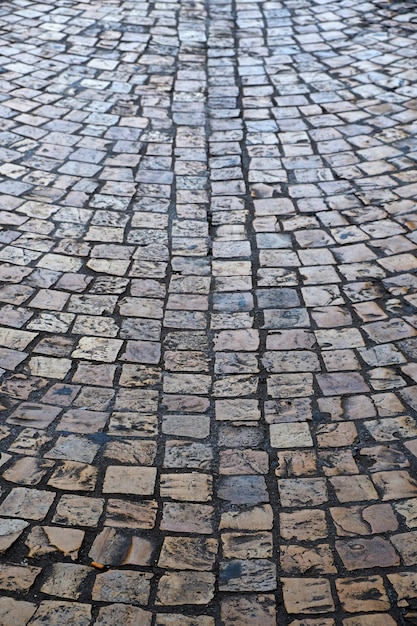 Old cobblestone street background texture vertical