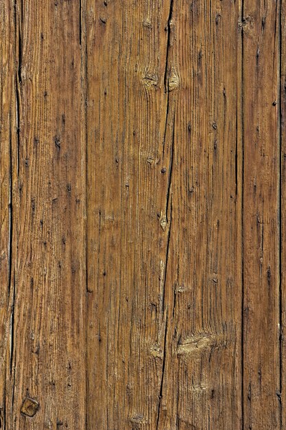 Old cracked faded wood board background vertical