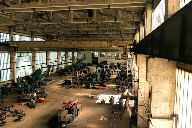 Free Photo old factory hall with equipment and machines and workers