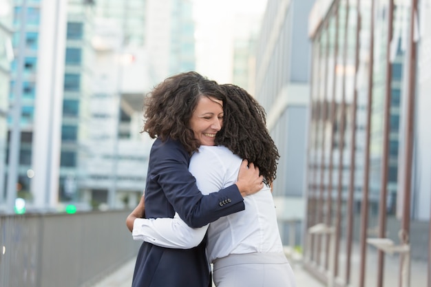 Old female friends glad to see each other