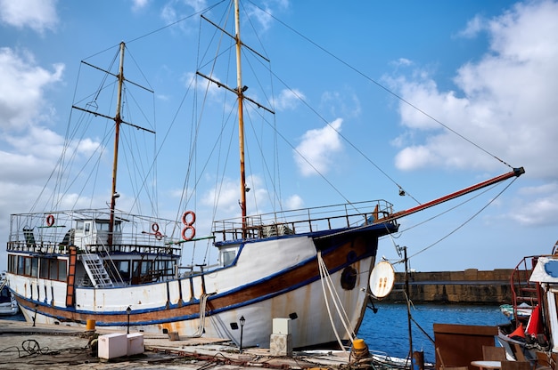 Free Photo old fishing boat in a port in the evening