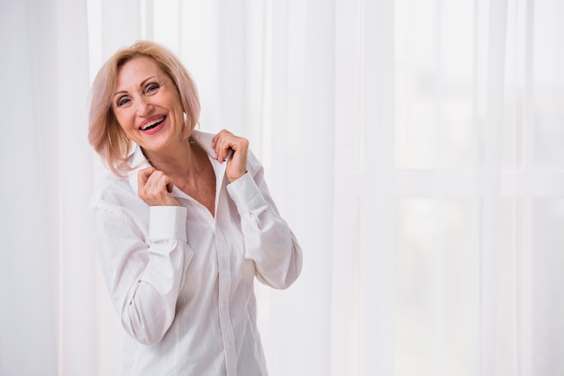 Free Photo old lady with short hair looking happy