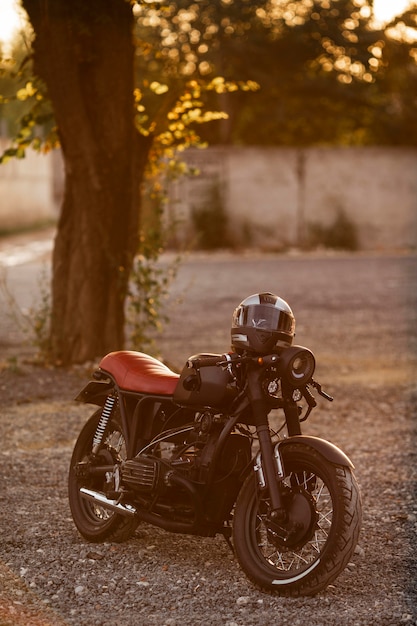 Old motorcycle with helmet outdoors