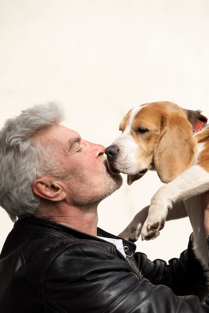 Free Photo old person with their pet dog