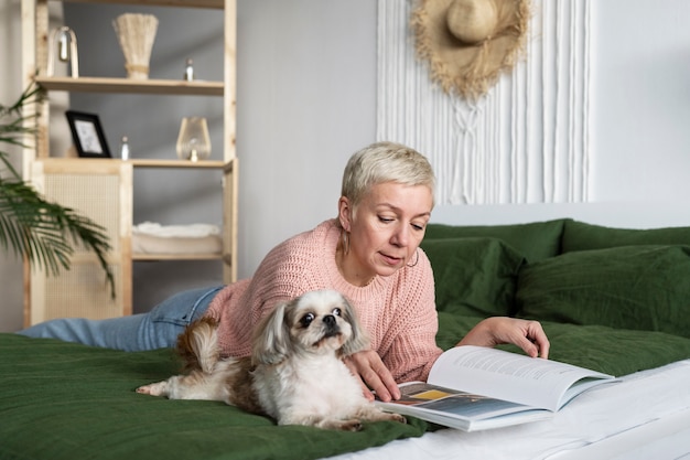 Free photo old person with their pet dog