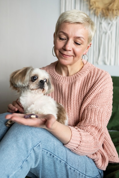 Free photo old person with their pet dog