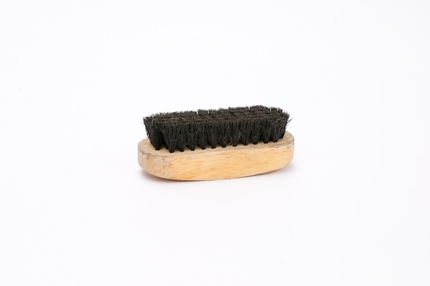 old shoe brush with wooden handle