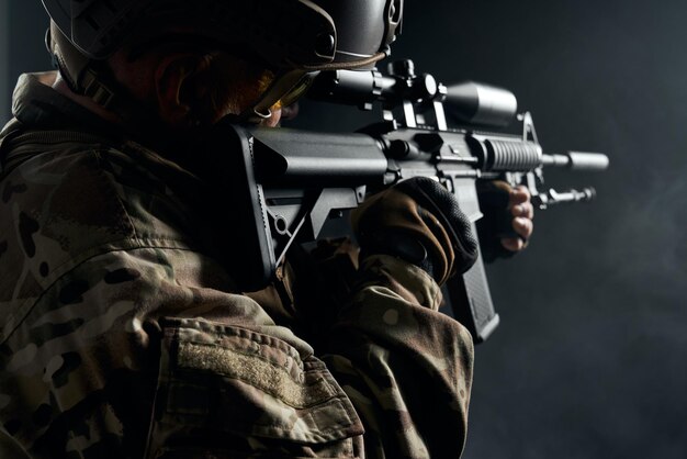 Old soldier in uniform pointing with sniper rifle