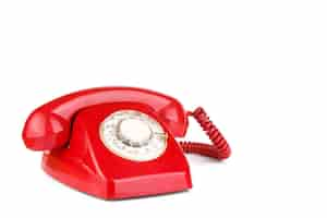 Free photo old telephone in red color isolated on white surface