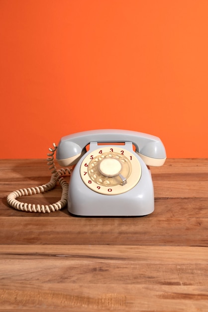 Old telephone on wooden table