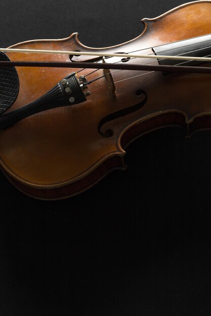 Old violin on a black background