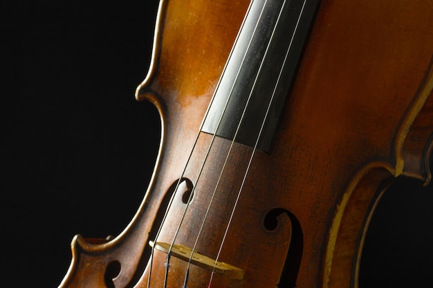 Free photo old violin on a black background