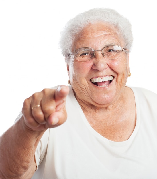 Old woman laughing and pointing