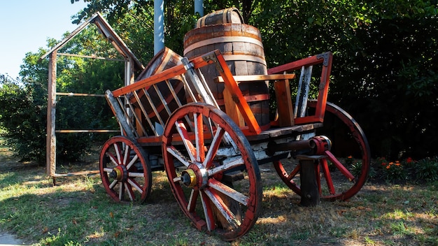 Free Photo an old wooden wagon with wooden wheels and barrels inside in varul cel mic, moldova