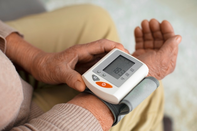 Older person checking their blood pressure with tensiometer