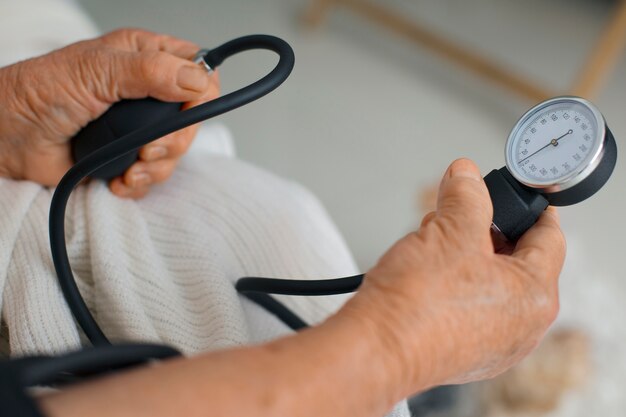 Older person checking their blood pressure with tensiometer