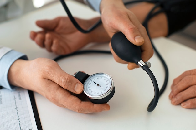 Older person checking their blood pressure with tensiometer