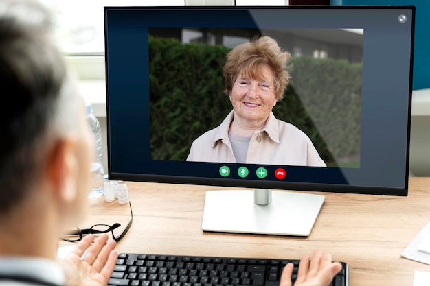 Older person using the video call feature on their device