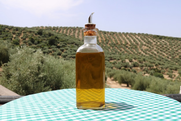 Olive oil with olives background