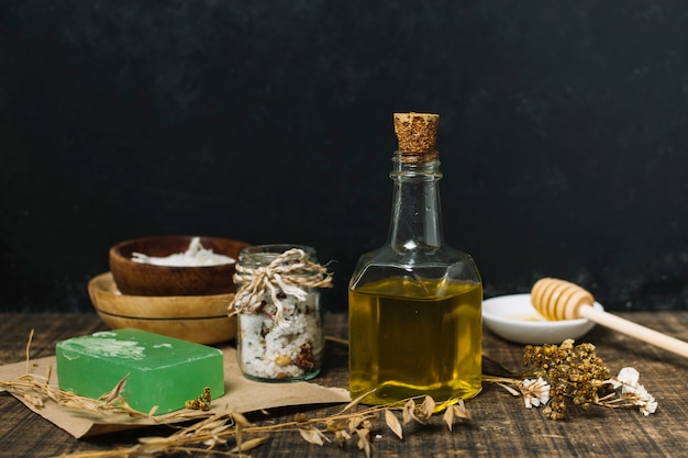 Free photo olive oil with soap bar and other ingredients