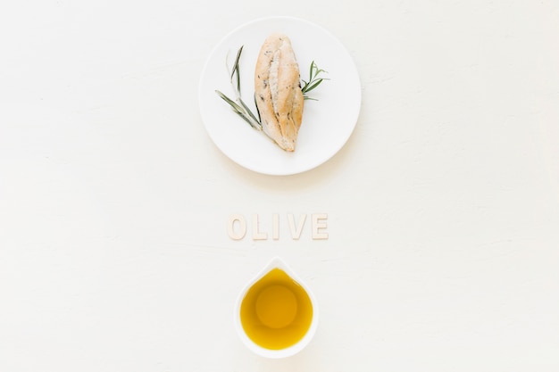 Free photo olive word with oil and bread