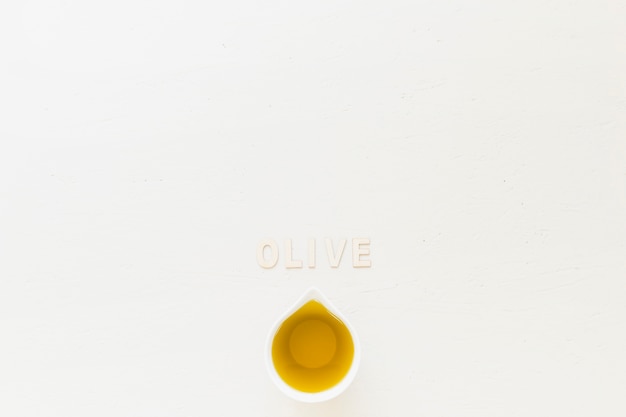 Olive word with olive in sauceboat