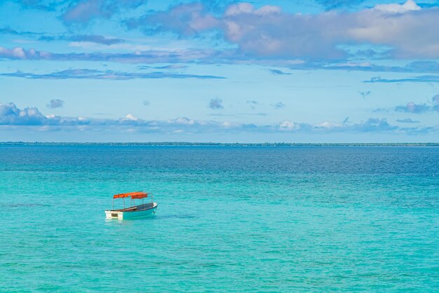 One fishing boat in water of Indian ocean. Zanzibar, Tanzania