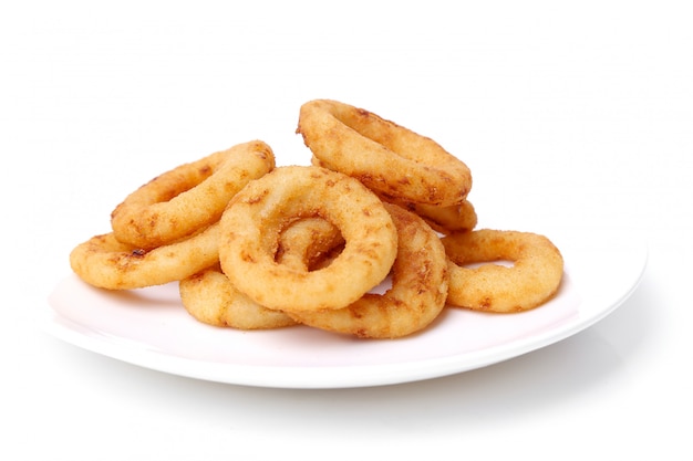 Onion rings and fries on white