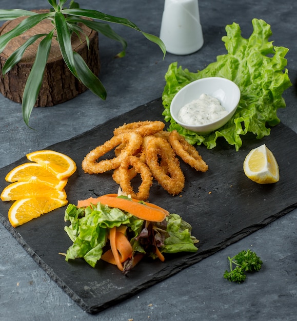 onion rings on wooden board