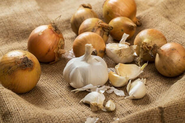 Onions and garlic on blanket