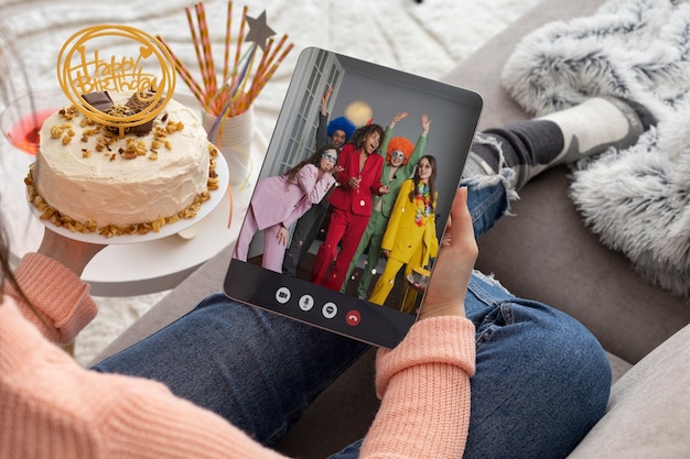 Online party celebration with tablet high angle