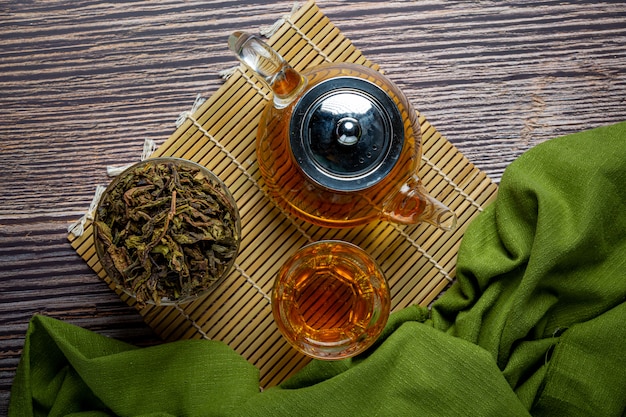 Free photo oolong green tea in a teapot and bowl.