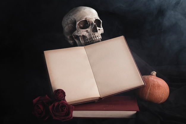 Free photo open book mock-up with roses and skull