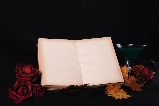 Free Photo open book mock-up with roses