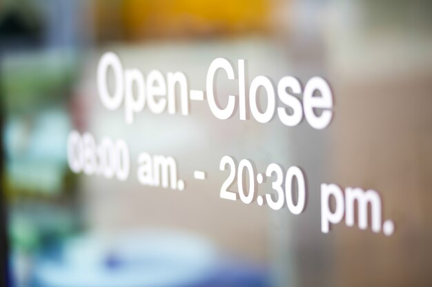 Open and Closed Sign on glass door