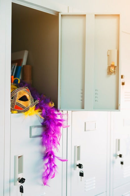 Free photo open locker with elegant party carnival props