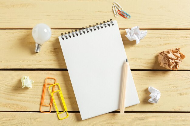 Open notepad on wooden background