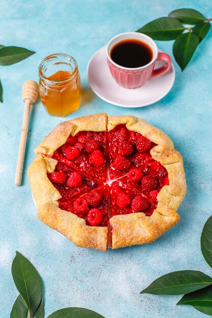 Open pie, raspberry galette. Summer berry dessert.