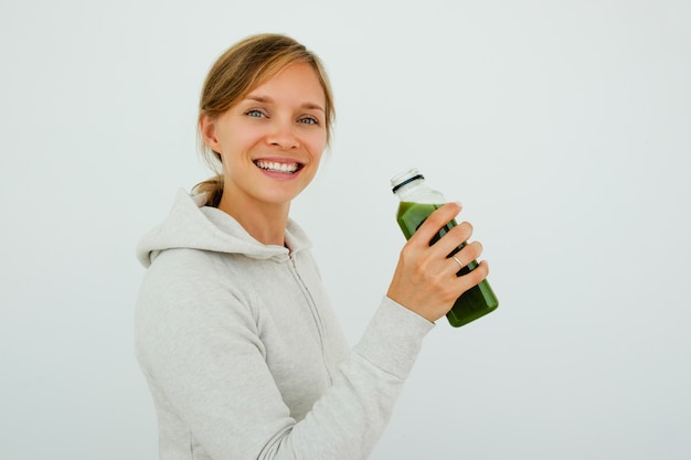 Free photo optimistic sporty woman maintaining balanced diet