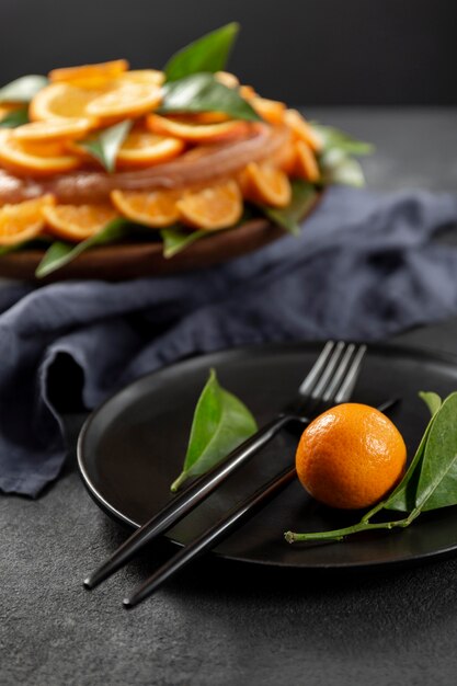 Orange cake with leaves and cutlery