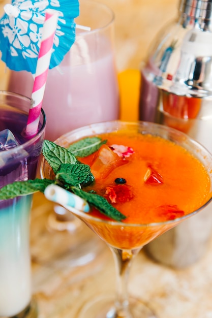 Orange cocktail and tropical fruits