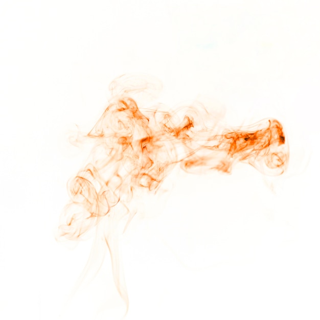 Free photo orange fume spreading on white background