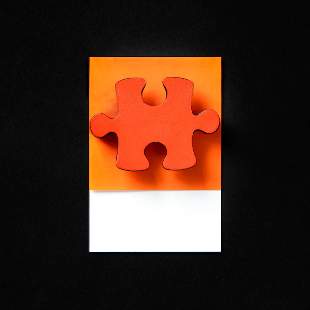 Free photo orange jigsaw game puzzle piece