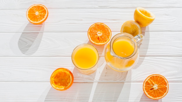 Free photo orange juice with squeezed fruit