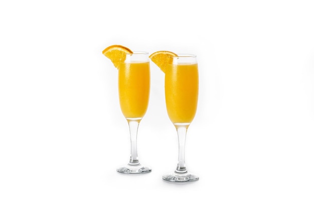 Orange mimosa cocktail isolated on white background