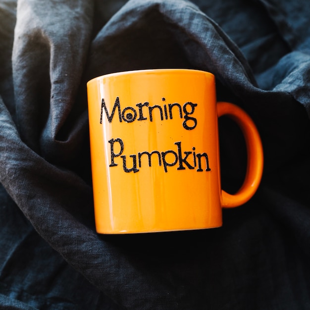 Orange mug with writing