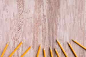 Free photo orange pencils on desk