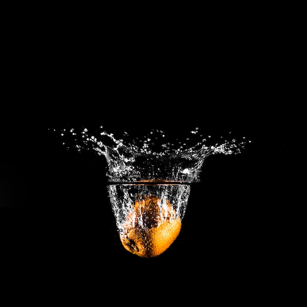 Orange plunging into the water