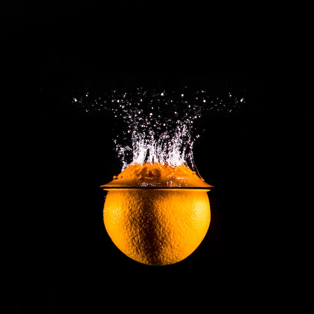 Orange plunging into the water